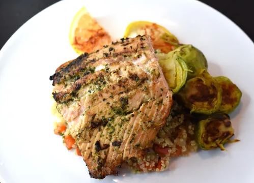 Herb Seared Salmon With butter quinoa, roasted vegetables and Olive Oil - Lemon Sauce. (Pescetarian)